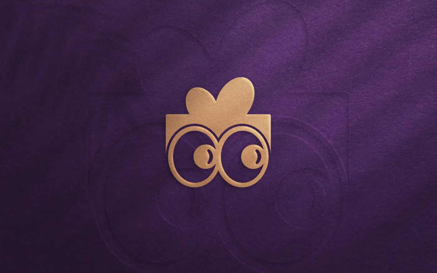 Geefty logo design, embossed gold foil on purple stock