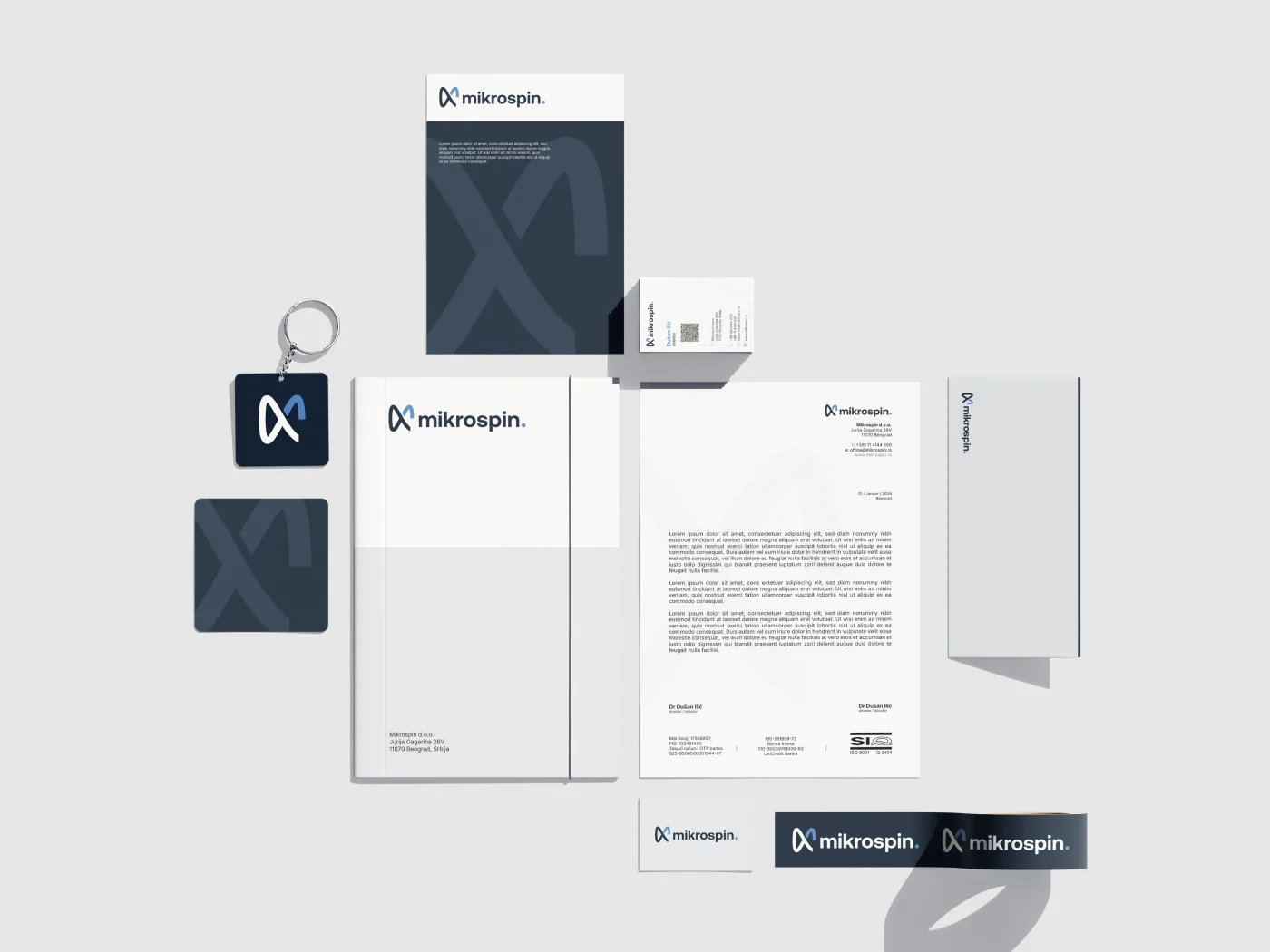 Mikrospin brand identity applied across stationery and collateral