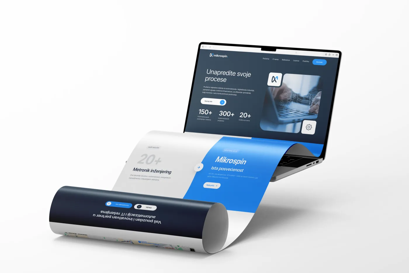 Mikrospin website shown on a laptop screen with a rolled print poster in front