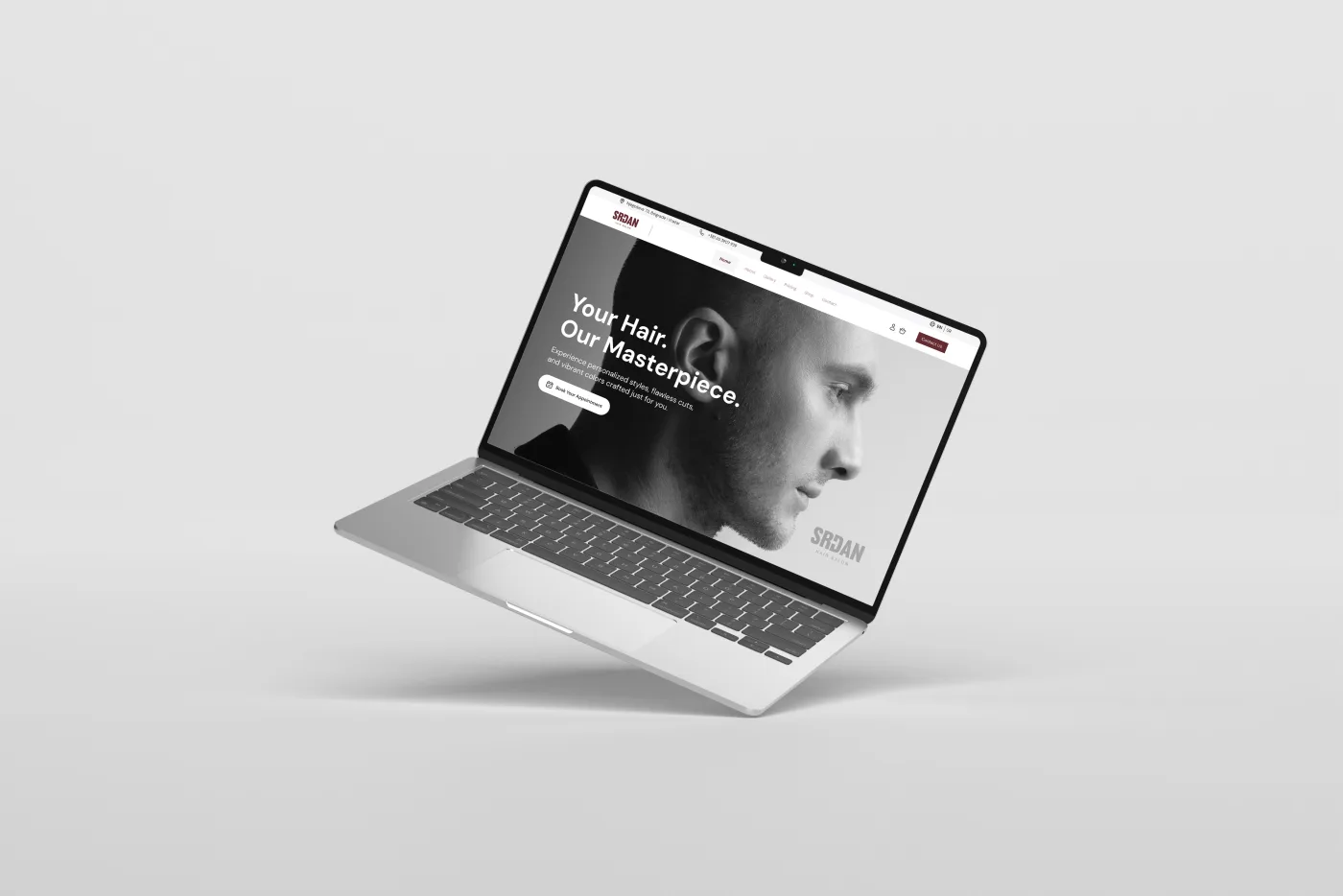 Srđan Hair website homepage shown on a laptop screen